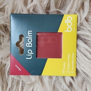 billion dollar brow lip balm. color peach